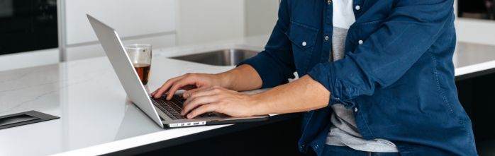 asian man working on laptop computer